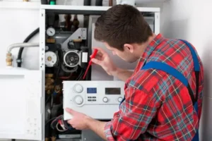 plumber repairing water heater